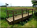 Footbridge and footpath by Falls Farm in PE23 5BU