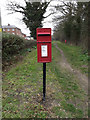 Stow Lodge Postbox & footpath in IP14 1UB