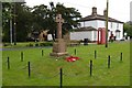 Village green, with war memorial and old-fashioned telephone box in Colne