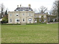 Blissamore Hall seen from footpath to the south in SP11 9HL