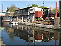 Canal-side yard with caravan as office in NW10 8JX