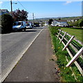 Wonky fence at the edge of Kings Road, Llandybie in SA18 3YF