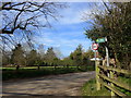 Road and path junction by Beenham Church in RG7 5NF