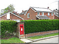 Postbox in The Street in NR14 7DA