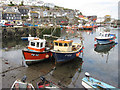 Fishing boats in Mevagissey inner harbour in PL26 6SS