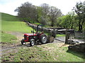 Farm tractor above Abercrave Woods in SA9 1TJ