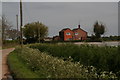 House, ditch, cow parsley and polythene-covered field: Hampton Lane, near Old Leake in PE22 0AN