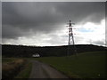 Pylon under threatening skies near Thrumpton in NG11 0AU