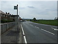 Bus stop and shelter on Millerhill Road (A6106), Newton Village in EH22 1FQ