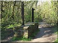 Burnt remains of an information board in Clyne Valley in SA2 7BA