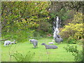 Waterfall and sheep at An Cala in PA34 4RF