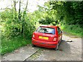 Byway with an abandoned Skoda, The Shoe, Wiltshire in SN14 8QU