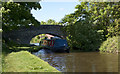 A narrow boat passing under bridge 54 on the Lancaster Canal in PR3 0PL