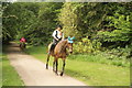 View of a pair of horseriders coming up the path by Chingford Golf Course in E4 7PG