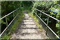 Footbridge crossing a small tributary of the Thames in OX14 3NG