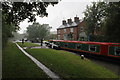 Dhavlos Cottage by Braunston Lock 4, Grand Union Canal in heavy rain in NN11 8BG