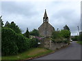 Looking along Church Lane towards All Saints in SN16 0HF