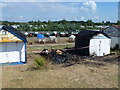 Burnt out beach hut on North Beach, Heacham in PE31 7AP