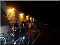 Bike riders outside of the Axe and Compasses in Aythorpe Roding