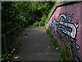 Graffiti on a path next to the A53 in ST4 7DE