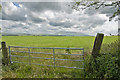 A gate at Rough Hill offering a view of Pendle Hill in BB7 4JJ
