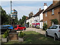 Stock village sign and view past the Hoop Public House (listed building) in CM4 9QU