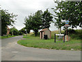 Bus shelter and village sign at Little Snoring in Little Snoring