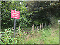 Sign on edge of woodland off Platt Lane in WN6 0YR