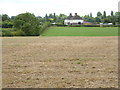 Dwellings on Bury Road seen from footpath to the north in RH20 1HE