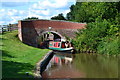Boat leaving Weston Lock under Brinepit Bridge in ST18 0JN