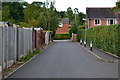 Lane behind houses from Andre Mills Bridge in ST15 8GF