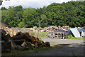 Wood stacks near Horsell Common in GU21 4XY