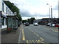Bus stop and shelter on King Street (A89) in EH48 4PN
