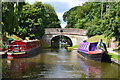 Colourful narrowboats moored at Tavern Bridge, Wheaton Aston in ST19 9QZ