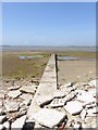 Jetty goes west on beach on Thorney Island in PO10 8DY