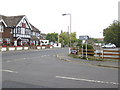 Looking across the junction of Pagham Road and Nyetimber Lane in PO21 3UE