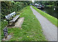 Seat and milepost along the Grand Union Canal towpath in UB8 1PP