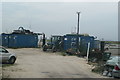 View of a tractor and container by the cockle sheds in West Leigh Ward