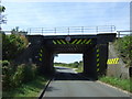 Low railway bridge crossing Froghall Road in MK45 1AA