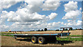 Trailer parked in harvested field in Ashby with Oby