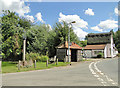 Lidgate village pond, sign, bus stop shelter and stores in CB8 9PU