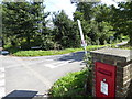 Junction of Washington Road and Sullington Lane with post box in RH20 4EZ