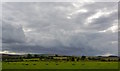 Brooding sky over The Sanctuary, near Avebury, Wiltshire in SN8 1QF