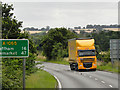 Yellow HGV on A1065 near Fakenham in NR21 9QZ