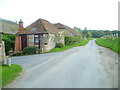 Looking along Selden Lane past buildings at Selden Farm in BN13 3UL