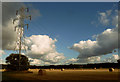 Pylons and bales between White Moss Farm and Hey's Crossing in WN8 9TG