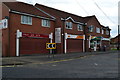 Parade of shops in Mill Lane, Adwick Le Street in DN6 7SG