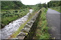 Dry stone wall between minor road and Hilton Beck at Ash Bank in CA16 6LS
