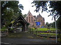 Lychgate and churchyard, All Saints' Church, Thelwall in WA4 2TF