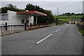 The A482 passing a former filling station in SA19 8RN
